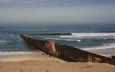 The fence is graffiti'd.