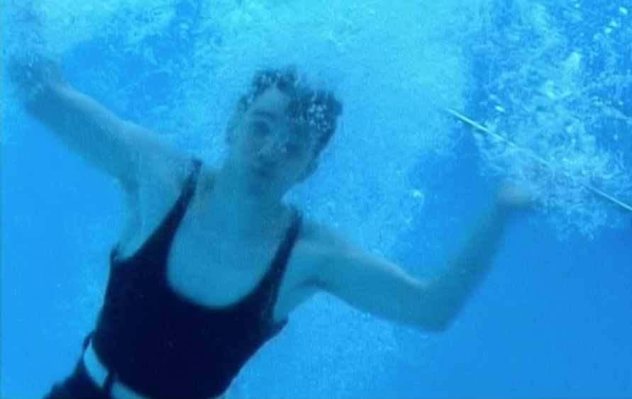 An underwater image of Walter having just dived into the pool.