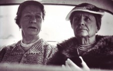 Seated alongside Polly in the rear of a car, both women wear deep frowns, Helen, in her 60s, looks deeply anxious, her mouth downturned.