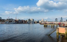 Daytime on the foreshore. The river is full, the water partway up the stairs and covers the foreshore.