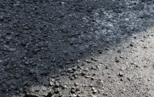 Photographed from above, on the wide shingle foreshore, deep in shadow, Liz is an almost-camouglaged dot on the landscape.