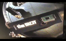 Title sequence showing close up of machine parts, with the words 'The Slot'