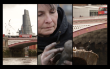 Screen is split vertically into three. Left and right, a span of bridge, its latticework painted red and white. A London bus rumbles across, the City in the background, with cranes showing building underway. Centre, the artist's face concentrates as she sculpts another figure.