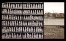 Screen is split vertically into three. Left and centre show around 100 of the completed figures, arrayed on black shelves. Right, the Thames riverbank, a barge and buildings on the far shore.